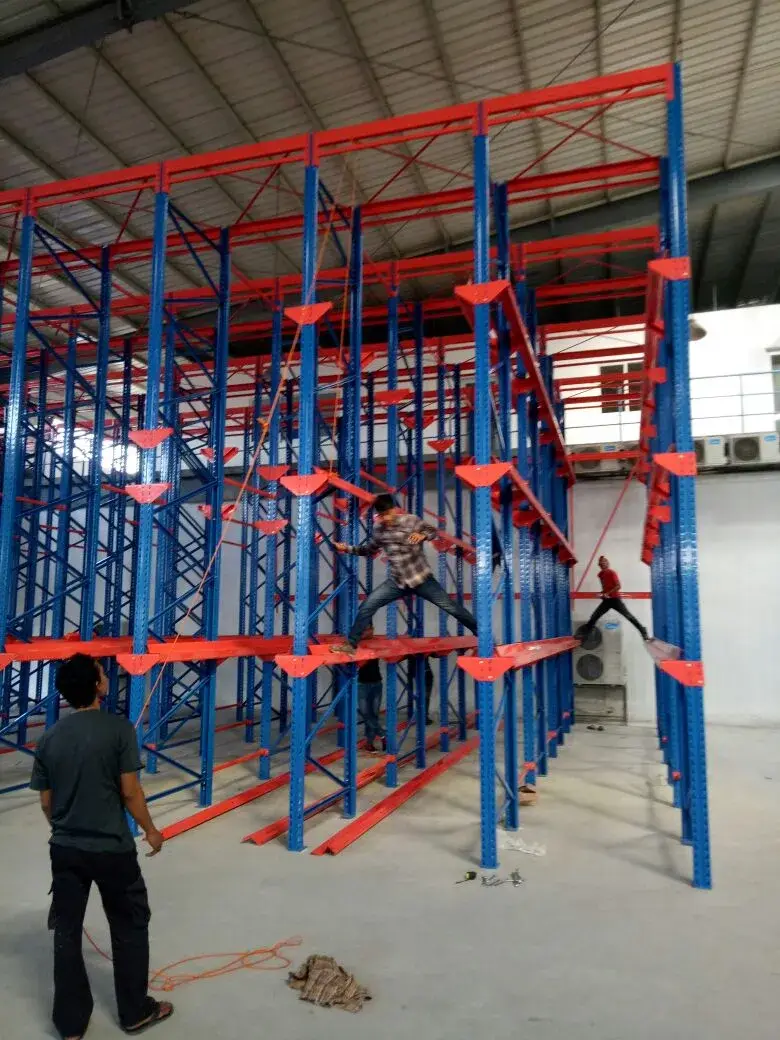 Rak Drive-In — Sistem first in last out. Hemat ruang, cocok untuk cold storage.